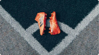 Hiking boots on rocky trail in mountainous landscape